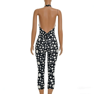 Detailed back view of halter neck polka dot bodysuit with ruched butt lifting design