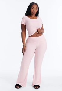 Pink two-piece casual set featuring a cropped letter print tee and high waisted flared pants