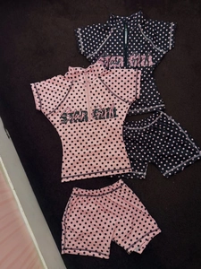 Two-piece polka dot swimsuit for girls featuring a Star Girl print and zipper front