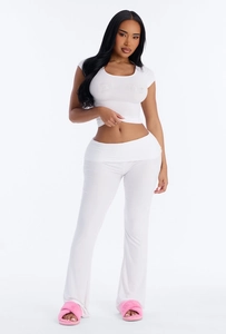 Detailed view of white two-piece set featuring glittery Bride text on a crop top and flared pants