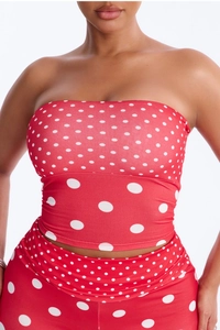Detail of red and white polka dot tube top and shorts set with elastic texture