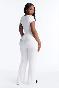 Detailed back view of white casual two-piece set with silver Bride print on flared pants