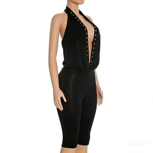 Side view of sexy black V-neck halter jumpsuit with rivet details and backless design