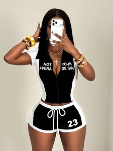 Women's black and white two-piece sportswear set with letter print and half-zip top