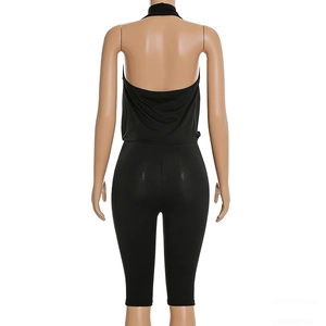 Back view of a black halter neck backless romper with slim fit stretchy fabric