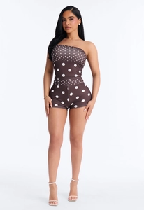 Detailed macro view of the brown polka dot texture on this backless tube top romper