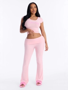 Women's pink two-piece set with 'Pretty' crop top and high waist flared trousers