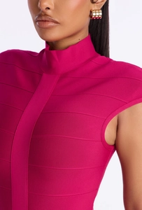 Macro shot of magenta bandage dress with mock neck and textured fabric detail