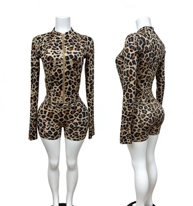 Detail of leopard print two-piece set featuring a zip-up top and high-waist bodycon shorts