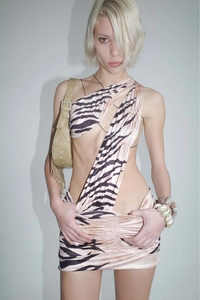 Detail of zebra pattern cut-out dress with asymmetrical shoulder and tie straps