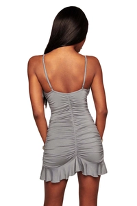 Close-up of the vertical ruching and ruffle hem detail on grey bodycon dress