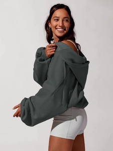 Detail of charcoal grey oversized hoodie featuring ribbed cuffs and dropped shoulder design