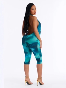 Tuta sexy con scollo all'americana e schiena scoperta con stampa floreale blu-verde