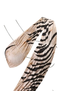Detailed close-up of tiger print ruched fabric on sexy sleeveless summer dress