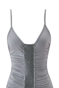 Detail of grey V-neck dress featuring silver sequin mesh trim and ruched fabric details