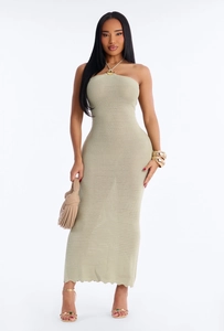 Close-up of light green knit maxi dress featuring hollow-out details and metal halter ring