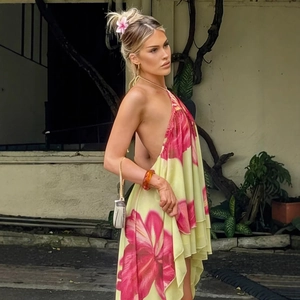 Halter backless summer dress with tropical floral print and asymmetrical tiered hem