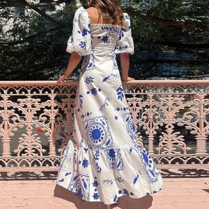 Elegant white maxi dress with blue sun pattern prints and lantern sleeves for women