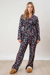 Navy blue Christmas pajama set with festive candy cane prints and cozy tie-up top