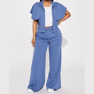 Detailed full view of a blue two-piece sports set with short-sleeve jacket and wide-leg pants
