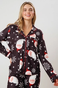 Women's Christmas pajama set featuring festive Santa and snowflake prints on black fabric