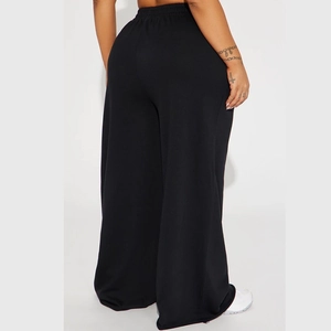 Rear view of black high-waisted wide-leg yoga pants with premium soft fabric drape