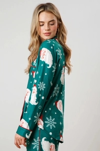 Detail of Christmas pajamas with Santa Claus print, classic collar and red piping edges
