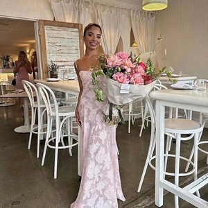 Detailed view of the pink floral maxi dress showing slim fit silhouette and floral pattern
