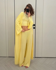 Detail of light yellow three-piece loungewear set with cardigan and wide-leg trousers