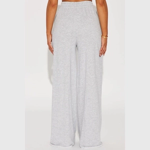 Detail view of high waist elastic waistband and drape of light grey wide leg lounge pants