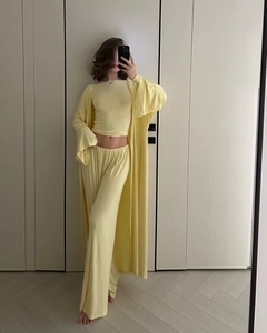 Detail view of yellow 3-piece loungewear set with cardigan, crop top and pants