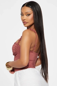 Detail of mauve knit halter top featuring twisted rope straps and pleated bust design