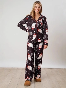 Women's Christmas pajama set with Santa and snowflake prints and red piping trim