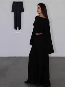 Minimalist black two-piece set featuring long sleeve top and high waist wide leg pants