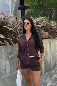 Detail view of brown striped fabric texture on button-down shirt and shorts set