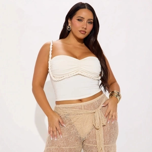 Women's white crop top with braided rope straps and crochet lace pants set