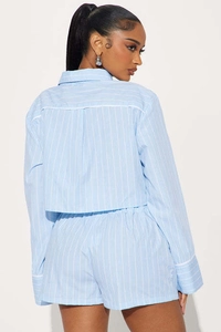Detailed back view of light blue striped crop shirt and matching high-waisted shorts set