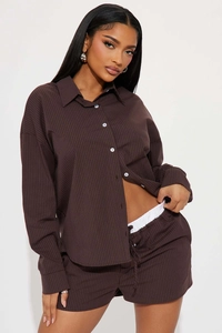 Close-up of dark brown pinstripe texture on cotton long sleeve shirt and shorts set