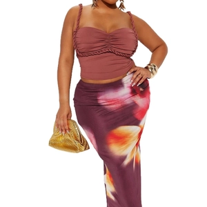 Women's chic two-piece set featuring a dusty pink crop top and floral maxi wrap skirt