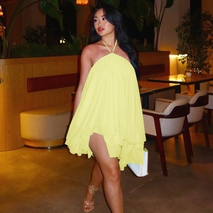 Detailed close-up of light yellow tiered chiffon babydoll dress with layered ruffles