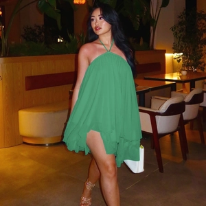 Detail of green halter neck chiffon mini dress with layered ruffles and open back design
