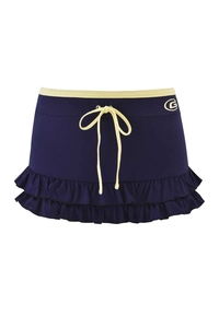 Detail of navy mini skirt featuring double ruffles and yellow contrast bow tie accent