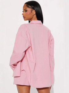 Back view of pink striped oversized long sleeve shirt and matching shorts lounge set
