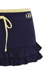 Detail of navy blue sports skirt with yellow belt, ruffled hem and G letter embroidery
