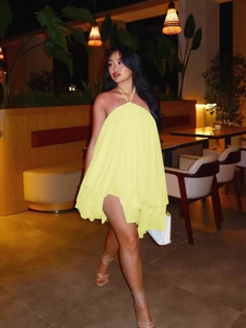 Chic yellow backless halter mini dress with tiered chiffon frills for summer fashion
