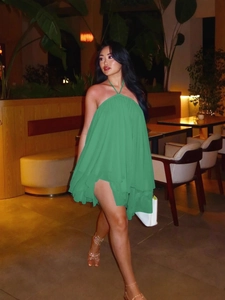 Grass green tiered babydoll mini dress with halter neck and lightweight mesh fabric