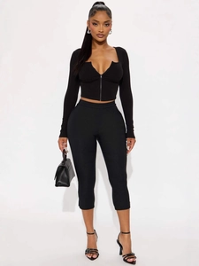 Women's black 2-piece sportswear set with V-neck zipper top and slim pants