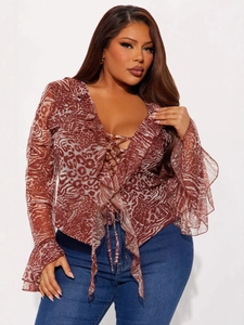 Women's animal print long sleeve top with ruffles and lace-up front detail