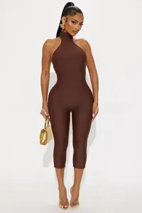 Detailed view of chocolate brown halter neck jumpsuit in high elastic slim fit fabric