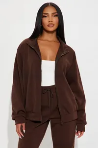 Detail view of deep brown women's two-piece set with metal zipper and drawstring waist